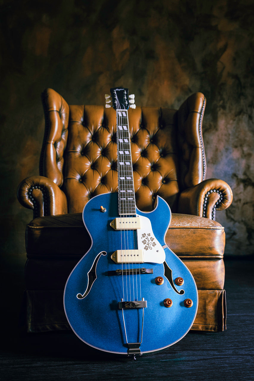 Pelham Blue CR 95 in front of chair