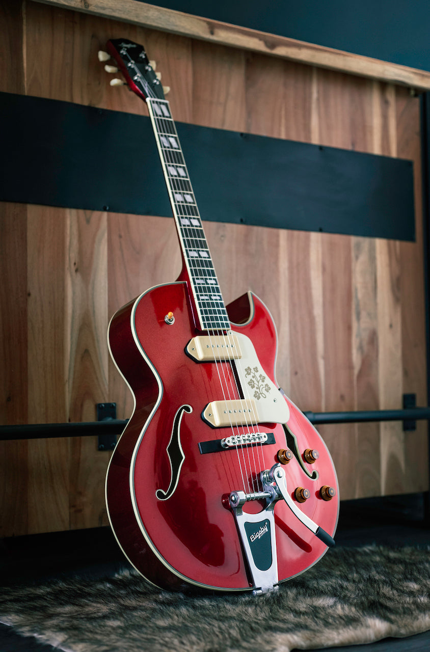 Stanford fatboy cr95 Candy Apple Red leaning against a counter